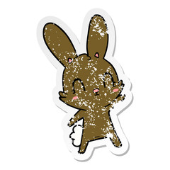 distressed sticker of a cute cartoon rabbit