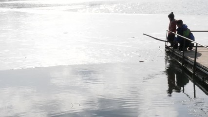 the beginning of spring. children play near the water.