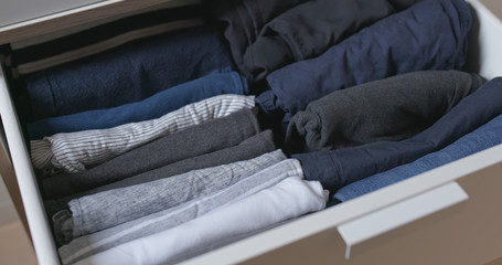 Open the drawer with clothes