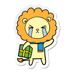 sticker of a cartoon crying lion