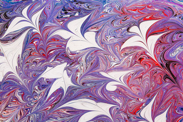 Abstract beautiful drawing of Ebru .Turkish style of painting Ebru on water with acrylic paints swirls waves.A stylish combination of natural luxury