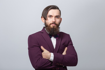 People, style and fashion concept - Portrait of bearded man dressed in white shirt over grey background