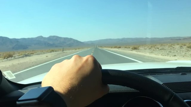 Point of view driving Ford Mustang in California desert USA