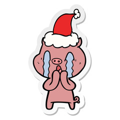 crying pig sticker cartoon of a wearing santa hat