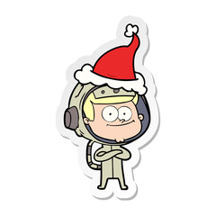 happy astronaut sticker cartoon of a wearing santa hat