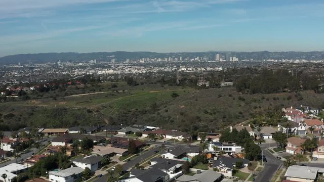 Aerial shot of a park with downtown Los Angeles in the background