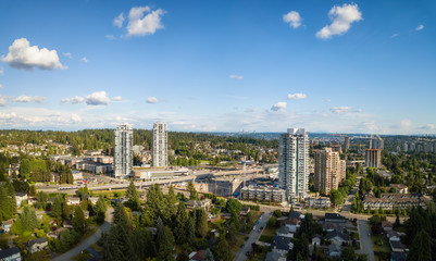 Aerial view of residential homes in a modern city during a vibrant summer sunny day. Taken in Port Moody, Vancouver, BC, Canada.