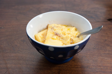 home made vanilla and cinnamon flan over a wooden table