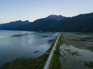 Aerial view of a beautiful Canadian Landscape during a vibrant summer sunset. Taken in Pitt Lake, Greater Vancouver, BC, Canada.