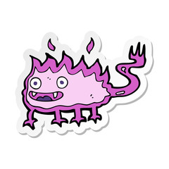 sticker of a cartoon little fire demon