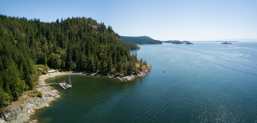 Aerial panoramic view of a rocky coast during a vibrant sunny summer day. Taken near Powell River,...