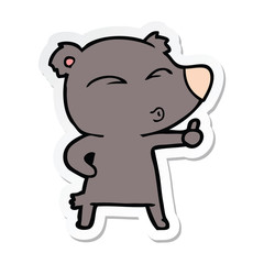 sticker of a cartoon whistling bear