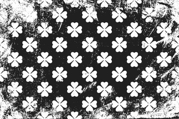 Grunge pattern with signs of clovers. Horizontal black and white backdrop.