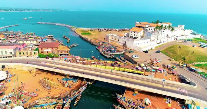 Entering the sea from the port. A beautiful footage of Elmina castle and a bridge over water. Portuguese