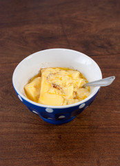 home made vanilla and cinnamon flan over a wooden table
