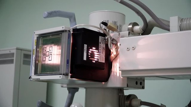 Medical active light X-ray machine operating in a hospital clinical lab, low angle shot