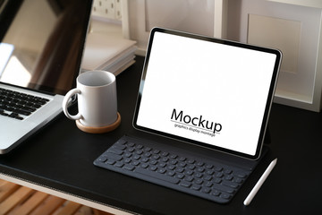 Workspace working desk with mock up tablet and laptop