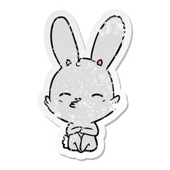 distressed sticker of a curious bunny cartoon