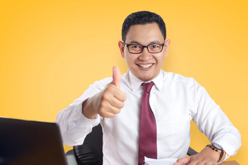 Businessman Smiling and Shows Thumbs Up Gesture