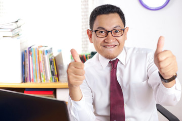 Businessman Smiling and Shows Thumbs Up Gesture