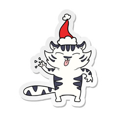sticker cartoon of a white tiger wearing santa hat