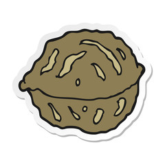 sticker of a cartoon walnut in shell