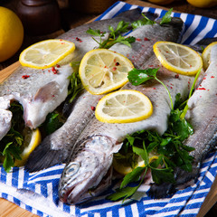 fresh trout with lemon and different herbs