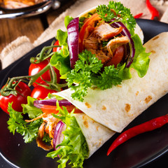 Tasty wraps filled with pulled pork and salad