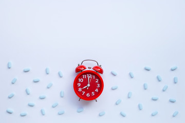 Red alarm clock ring with "PrEP" ( Pre-Exposure Prophylaxis). used to prevent HIV. T