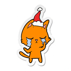 crying sticker cartoon of a cat wearing santa hat