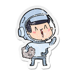 distressed sticker of a happy cartoon astronaut with moon rock