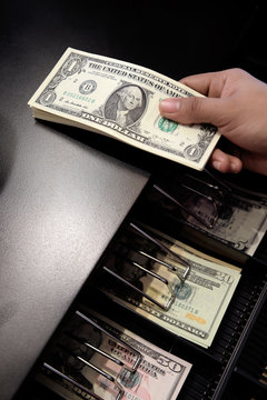 High Angle View Of Cashier Searching For Change In Cash