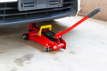 red tool jack lift car for repair check Maintenance of cars 