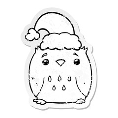 distressed sticker of a cute cartoon owl wearing christmas hat