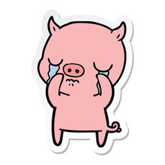 sticker of a cartoon pig crying