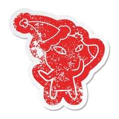 cute cartoon distressed sticker of a bear wearing santa hat
