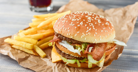 burger and  fries. take away lunch, fast food restaurant, fast food menu.pink background, selective focus and copy space. 