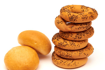 Homemade bagels with poppy seeds - bread products with wheat flour, wheat ears of wheat and grains are the harvest of a person's work.