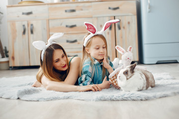 Cute little girl with mother. Family at home. Mother with daughter in a room