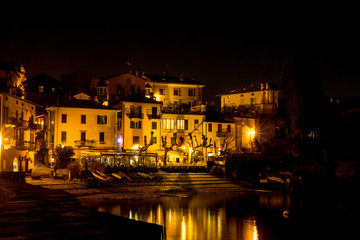 Italy, Varenna, Lake Como, a lit up city at night