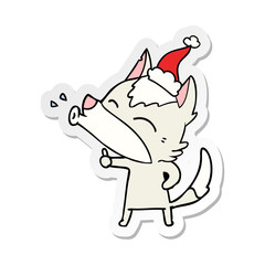 howling wolf sticker cartoon of a wearing santa hat