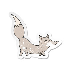 retro distressed sticker of a cartoon little wolf