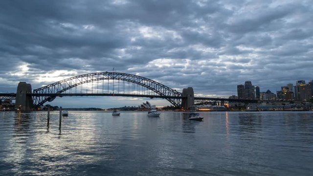 SYDNEY, AUSTRALIA - SEPTEMBER 16, 2016: 4K Cinematic Zooming Out Time Lapse Footage for Sydney city skyline at sunrise, taken from Blues Point Reserve north of Sydney.