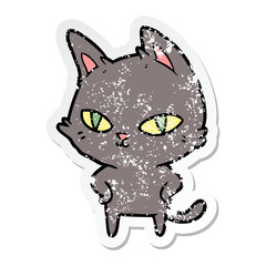 distressed sticker of a cartoon cat with bright eyes