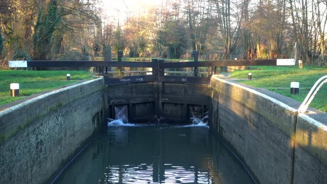 Closed gates at a canal Lock on a sunny winter morning in England