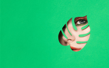 The Face of the Young Beautiful Woman with Bright Pink Shadows and Expressive Eyelashes, Looks in...