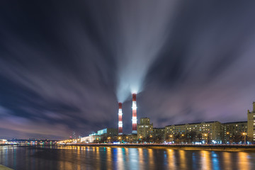 The evening or night view on the thermal power station on the Moskva river embankment in Moscow, Russia