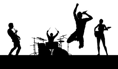 A musical group or rock band playing a concert in silhouette