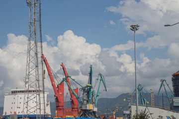 Sea port with cranes and docks early in the morning