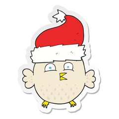 sticker of a cartoon owl wearing christmas hat
